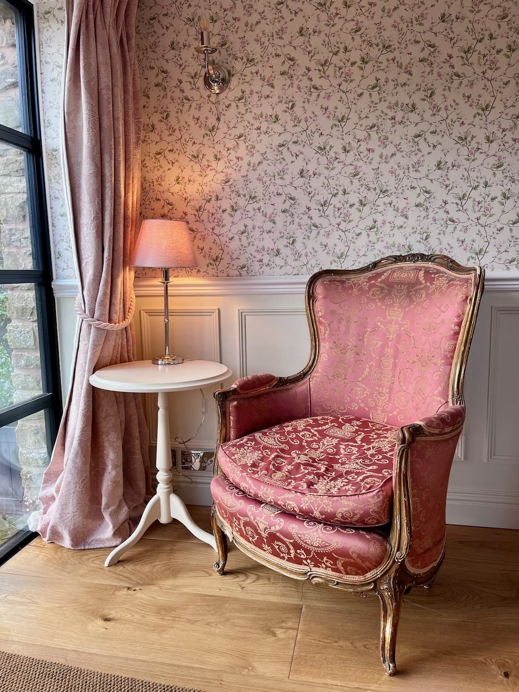 An antique armchair by the window at Ruthlin