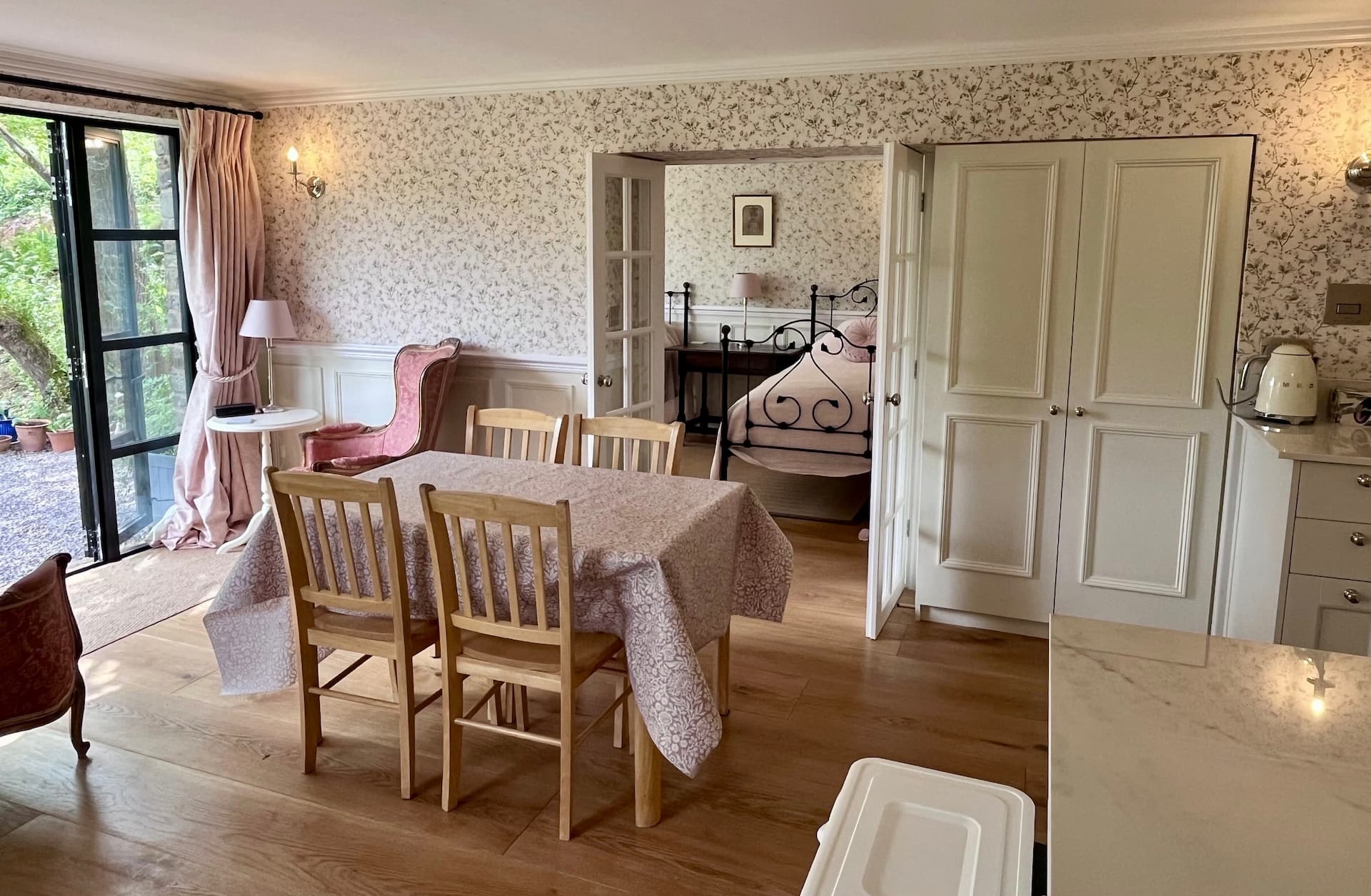 The open-plan living and dining room at Ruthlin, luxury accommodation in Skenfrith, looking through to the bedroom