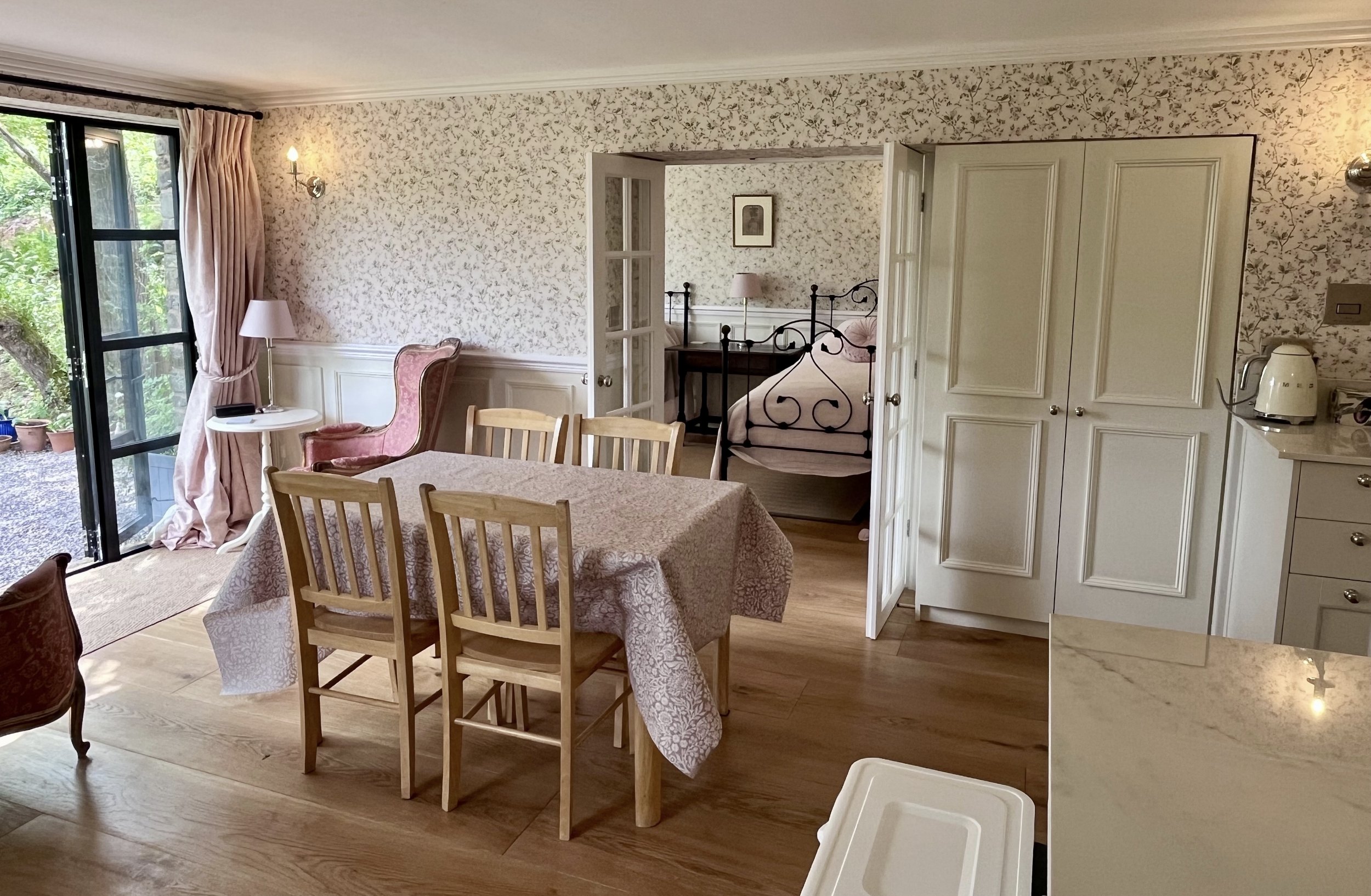The open-plan living and dining room at Ruthlin, looking through to the bedroom